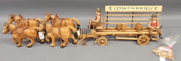 Appraisal: Lowenbrau wooden advertising toy wagon with composition horses approx l