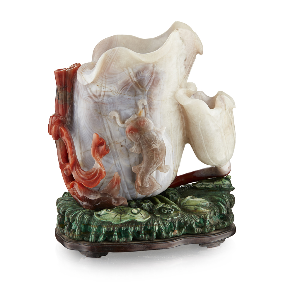 Appraisal: CARVED AGATE LIBATION CUP the lotus leaf shaped vessel carved