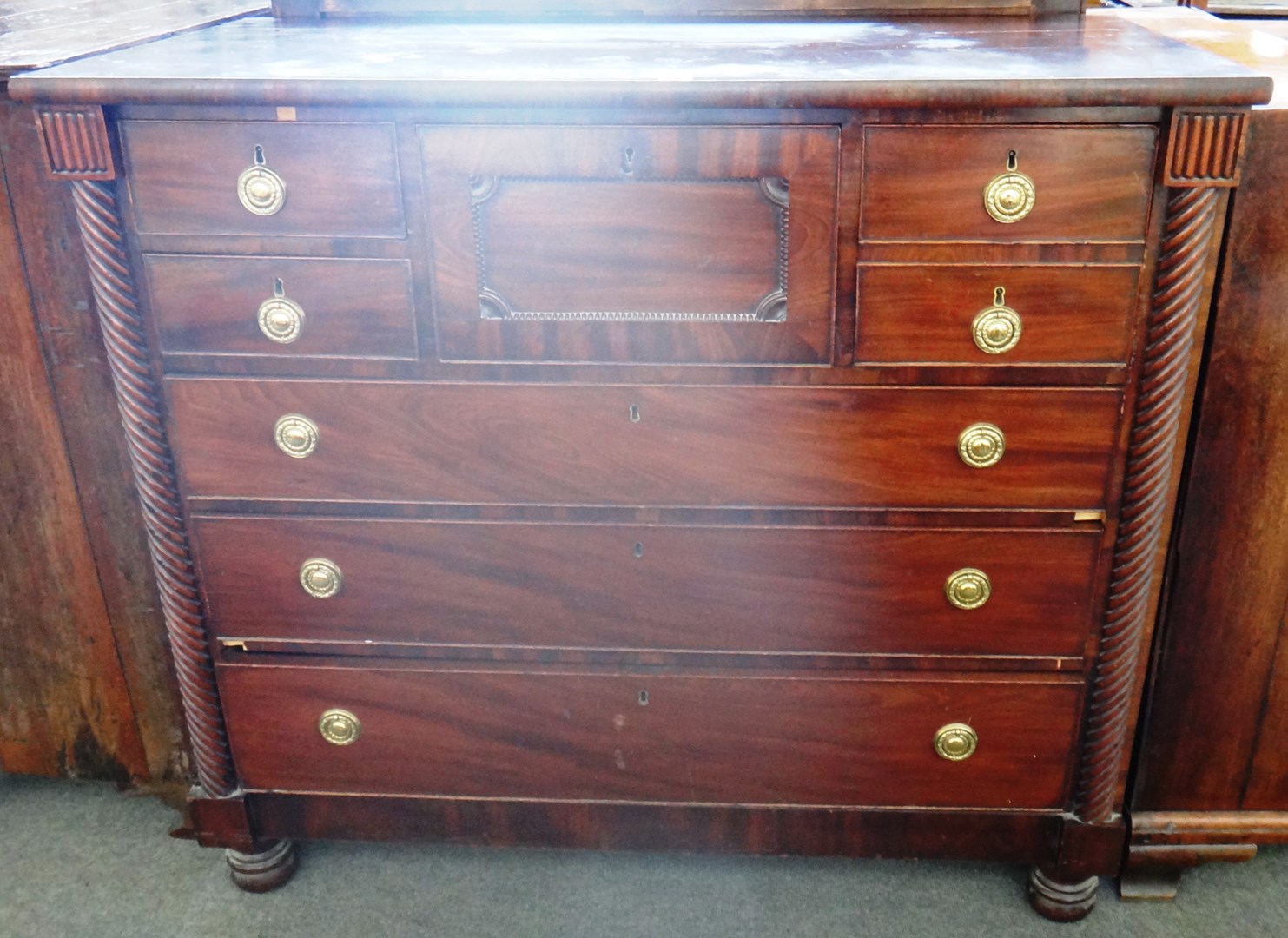 Appraisal: A th century Scottish mahogany chest of four short over