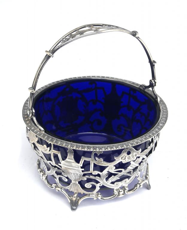 Appraisal: AN EDWARD VII PIERCED AND ENGRAVED SUGAR BASKET with neo