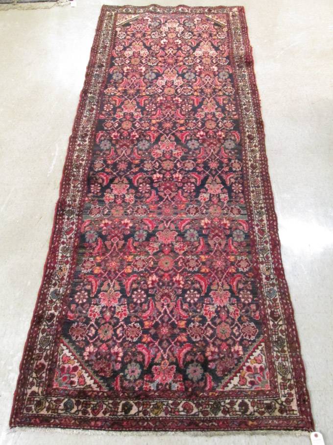 Appraisal: SEMI-ANTIQUE PERSIAN AREA RUG hand knotted in an overall Herti