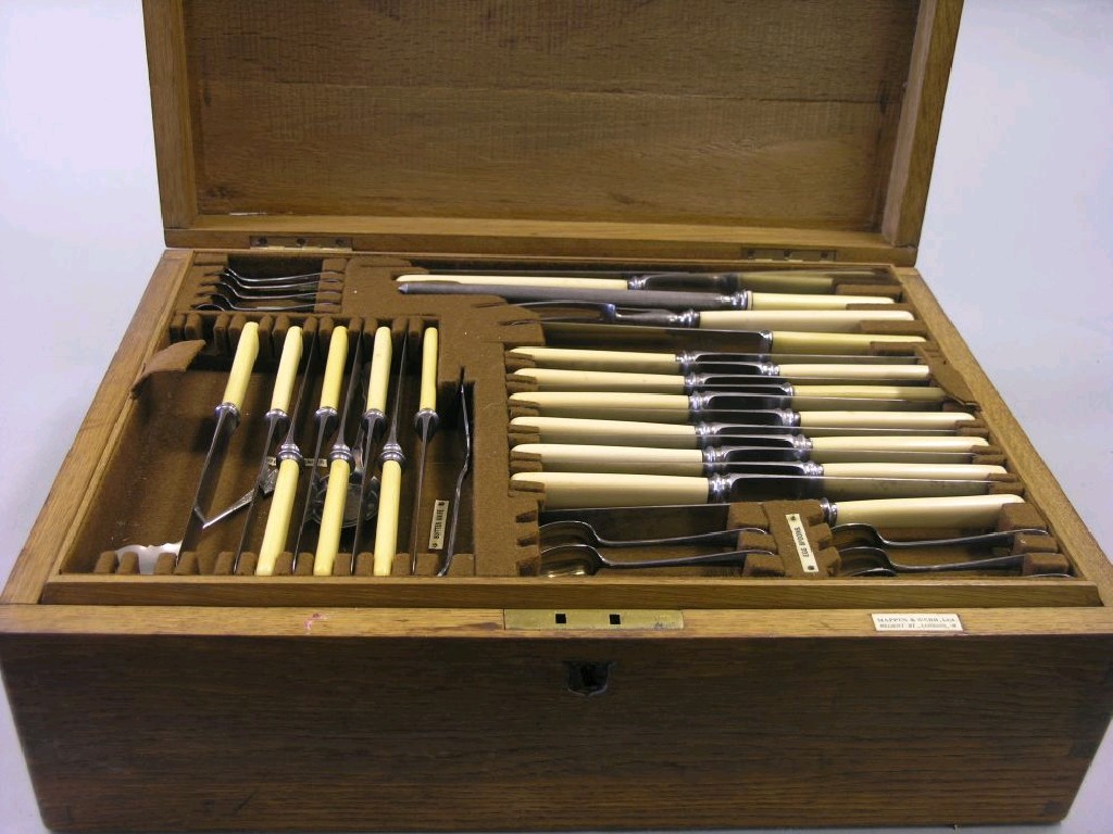 Appraisal: A Mappin Webb canteen of cutlery pieces oak canteen with