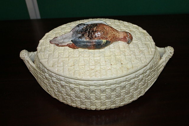 Appraisal: A POTTERY BASKET WEAVE GAME PIE DISH of oval form