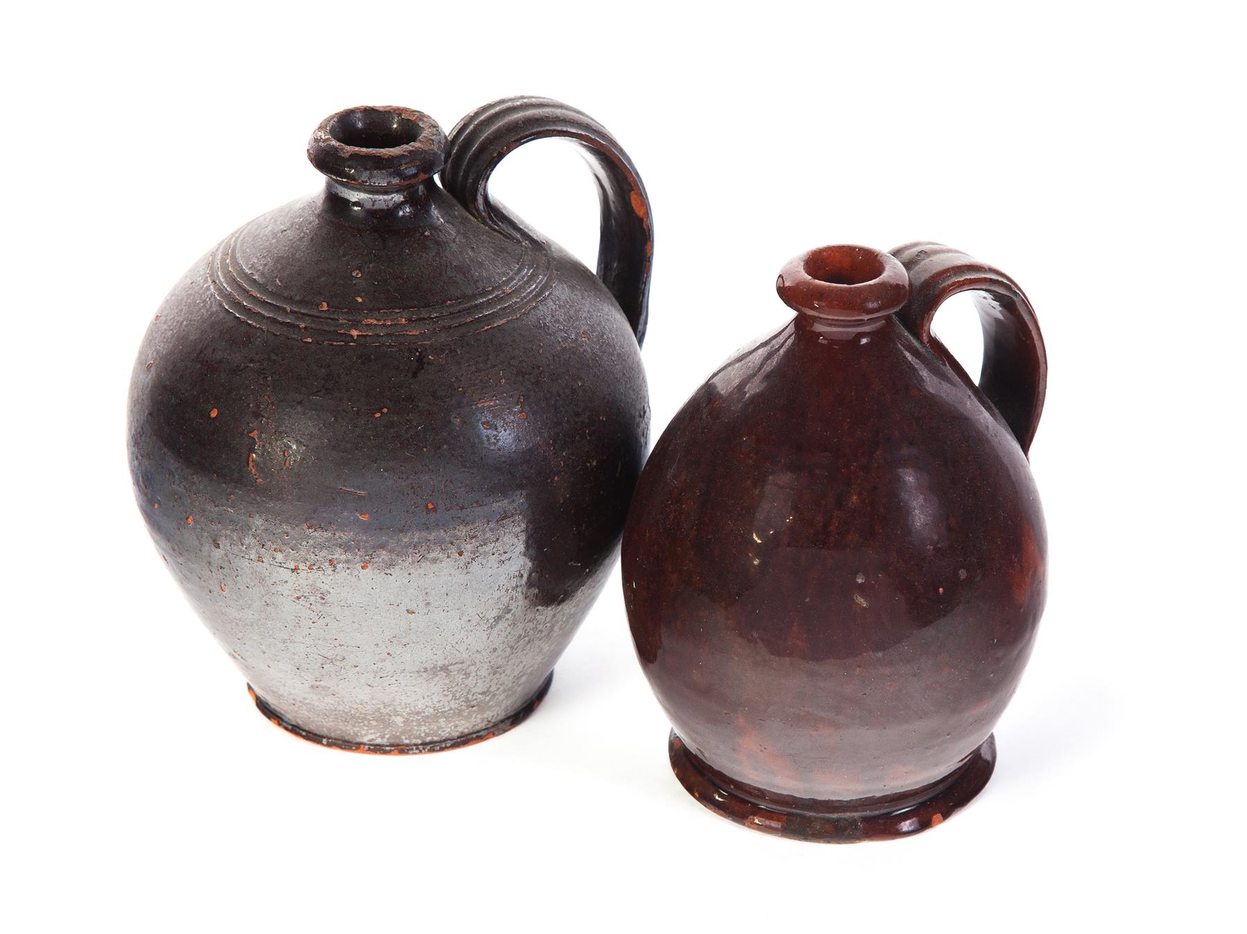 Appraisal: TWO AMERICAN REDWARE JUGS Mid th century Ovoid with applied