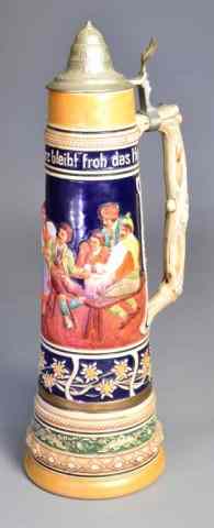 Appraisal: DECORATIVE CERAMIC GERMAN BEER STEINColorful ornate stein depicting a group