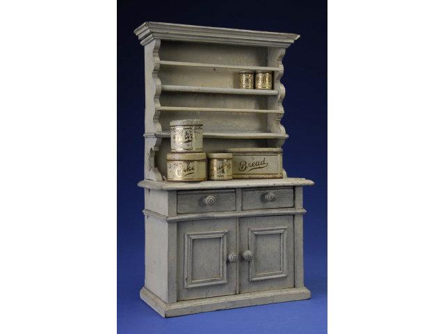 Appraisal: Painted Stepback Doll Size Cupboard with Tins Early th century