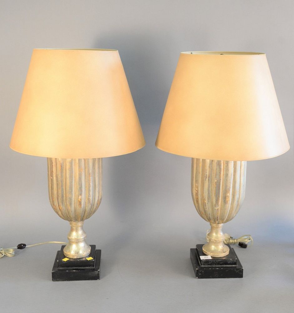 Appraisal: Pair of silvered wood lamps each in urn form on