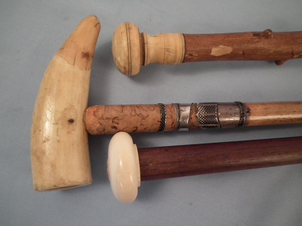 Appraisal: ANTIQUE CANES Lot of antique canes with wooden shafts inch