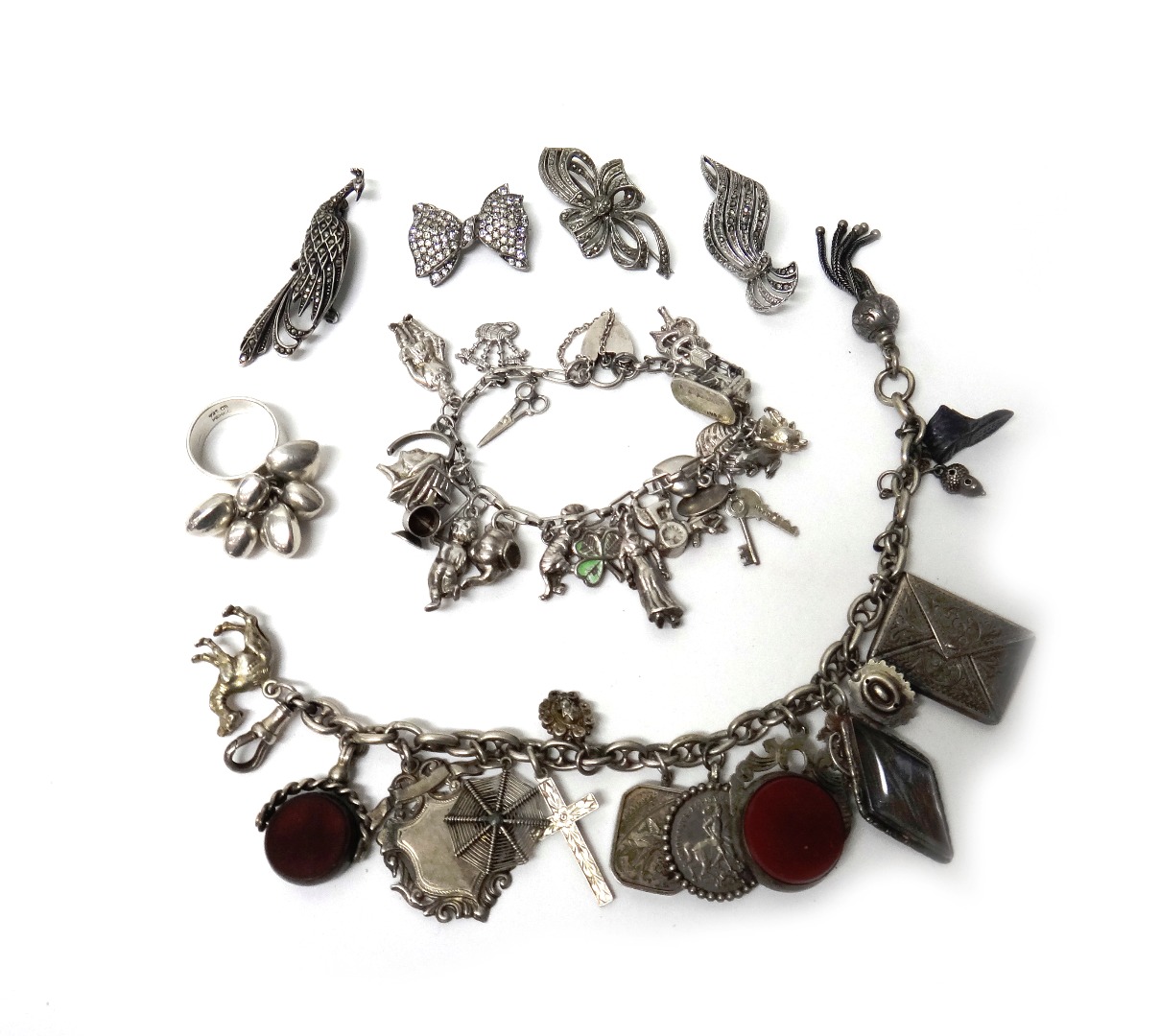 Appraisal: A silver charm bracelet fitted with a variety of mostly