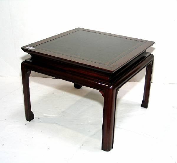 Appraisal: A pair of Asian style leather inlaid mahogany side tables