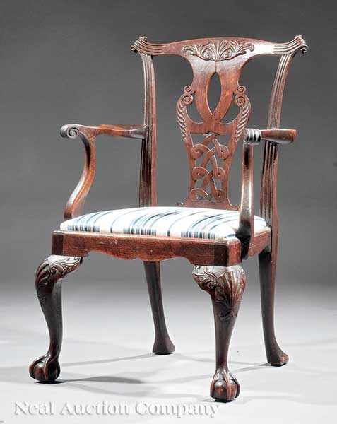 Appraisal: An Irish Chippendale-Style Carved Mahogany Armchair th c and later