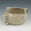 Appraisal: McCoy handled pouring bowl in high glaze with brown mottling