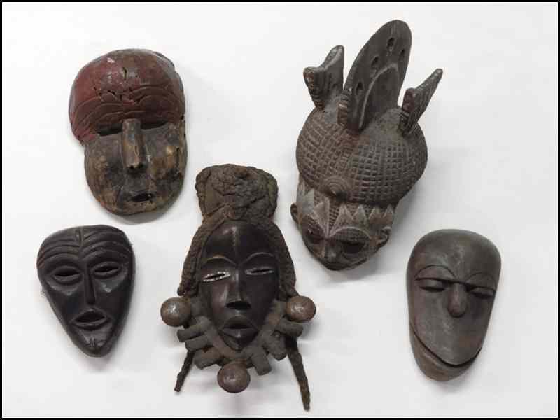 Appraisal: FIVE AFRICAN CARVED WOOD MASKS Largest '' Condition No Specific