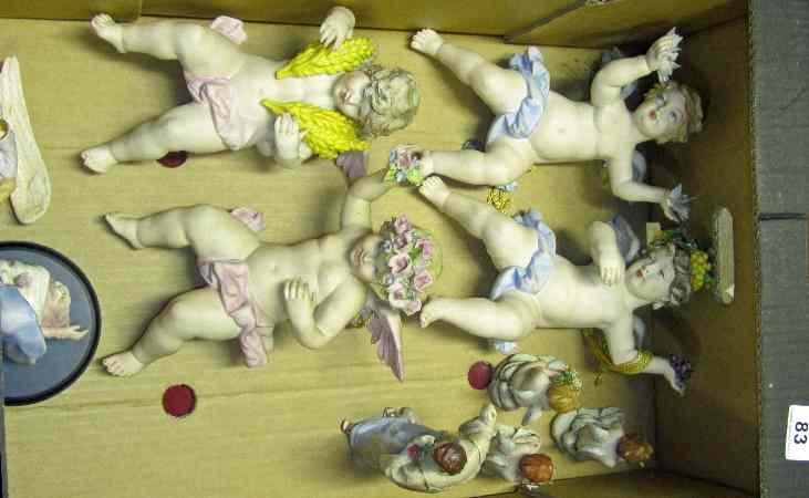 Appraisal: Capodemonte porcelain Nativity set and large cupid wallplaques