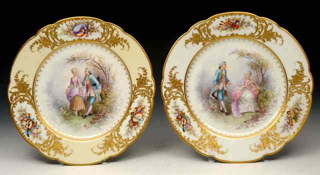 Appraisal: A HARLEQUIN PAIR OF SEVRES STYLE PLATES each painted with