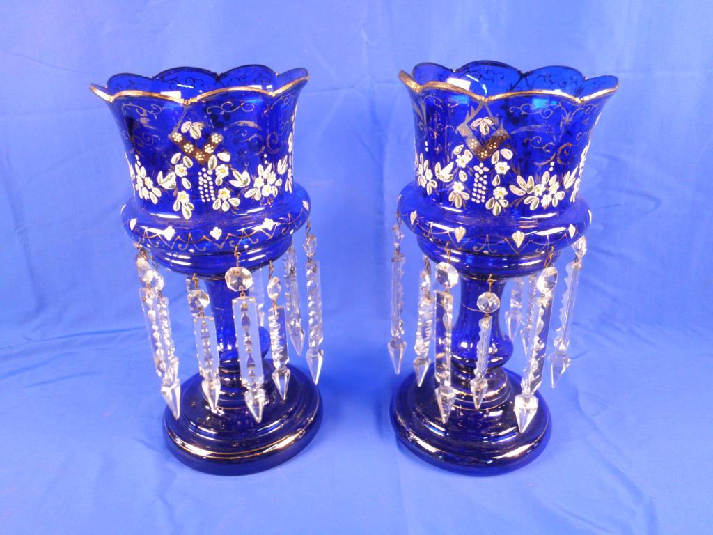 Appraisal: A pair of Victorian blue glass table lustres each decorated