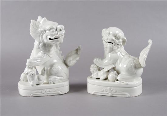 Appraisal: A Pair of Chinese Blanc de Chine Foo Dogs Height