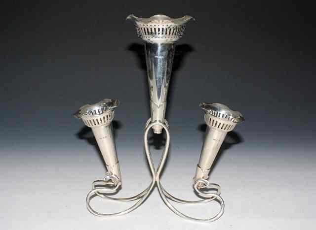 Appraisal: A SILVER EPERGNE WITH THREE DETACHABLE TRUMPET VASES with decoration