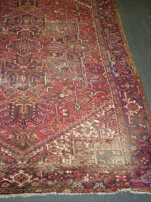 Appraisal: A Heriz carpet with star design medallion in a red