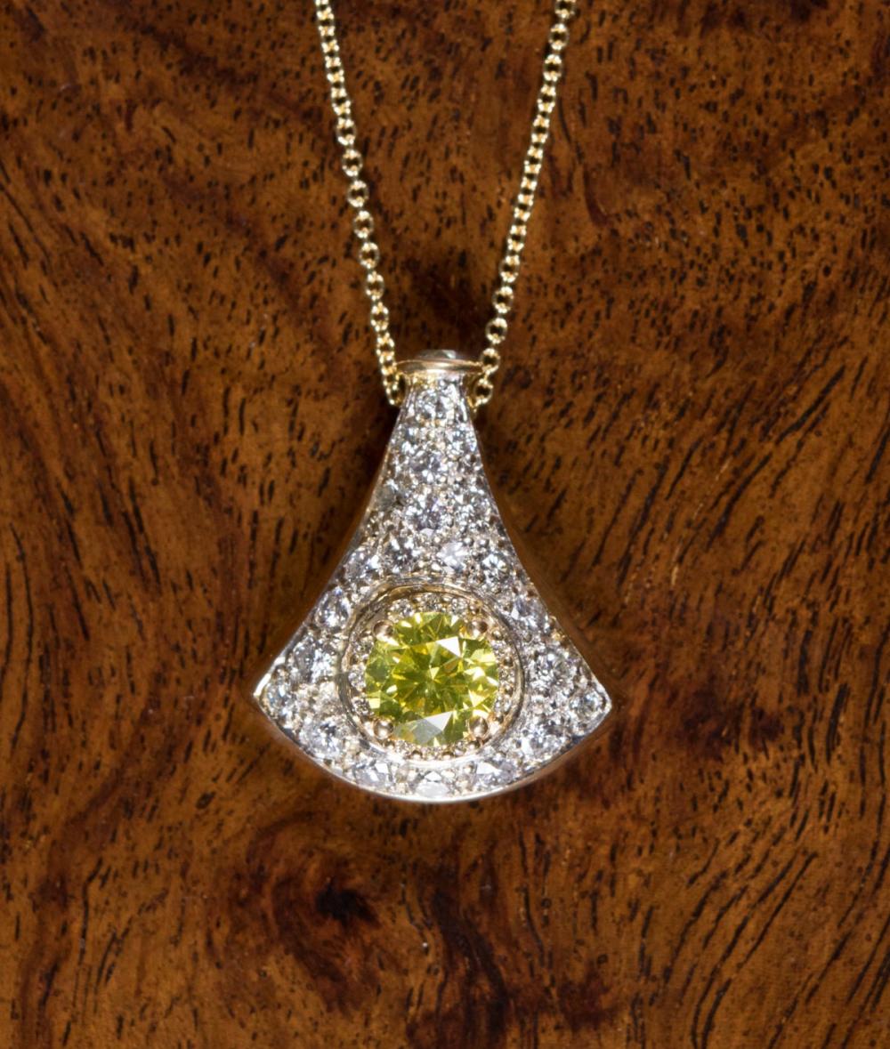 Appraisal: YELLOW AND WHITE DIAMOND PENDANT NECKLACE with an k yellow