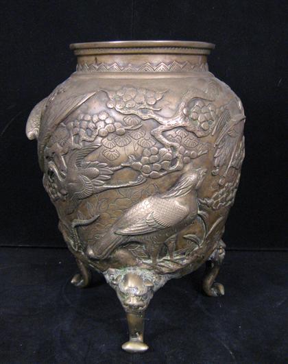 Appraisal: Bronze jardiniere On three legs with relief design of cranes