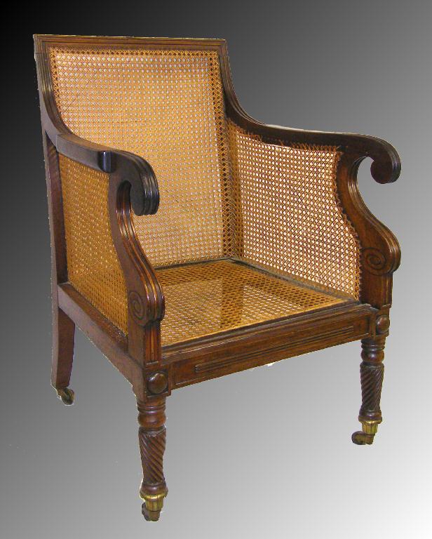 Appraisal: Good Regency mahogany bergere library armchair with fluted scrolling arms