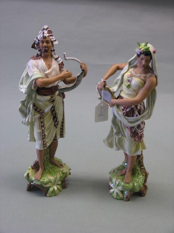 Appraisal: A pair of continental porcelain figures North African male and