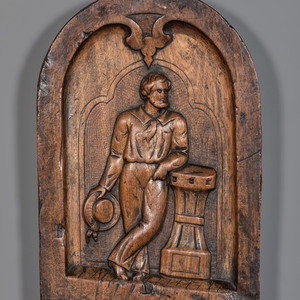 Appraisal: A Carved Walnut Ship Board Panel of a Sailor Likely