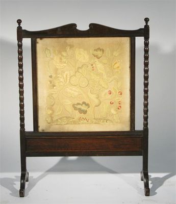 Appraisal: An Arts and Crafts oak and embroidery firescreen in the