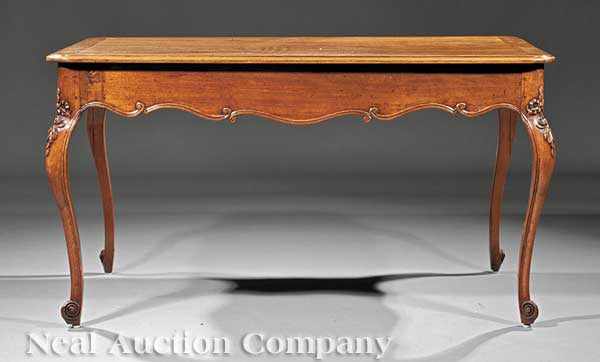 Appraisal: A French Provincial Carved Mahogany Salon Table th c rectangular