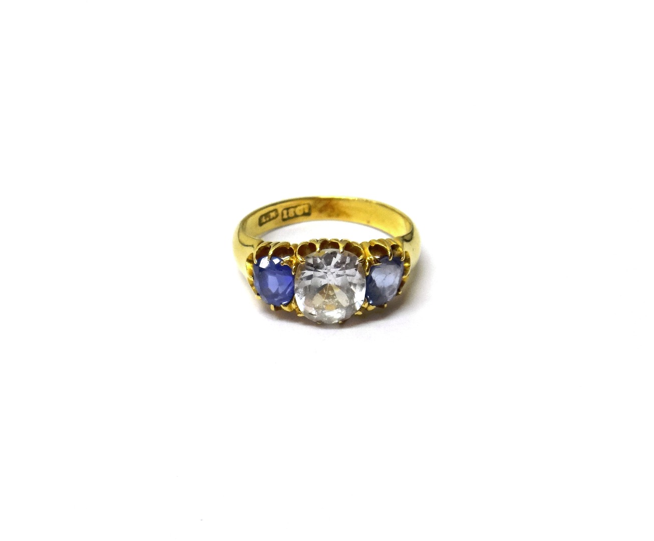 Appraisal: A gold colourless sapphire and Ceylon sapphire set three stone