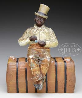 Appraisal: RARE DOORSTOP OF AN AFRICAN AMERICAN MAN SEATED ON COTTON