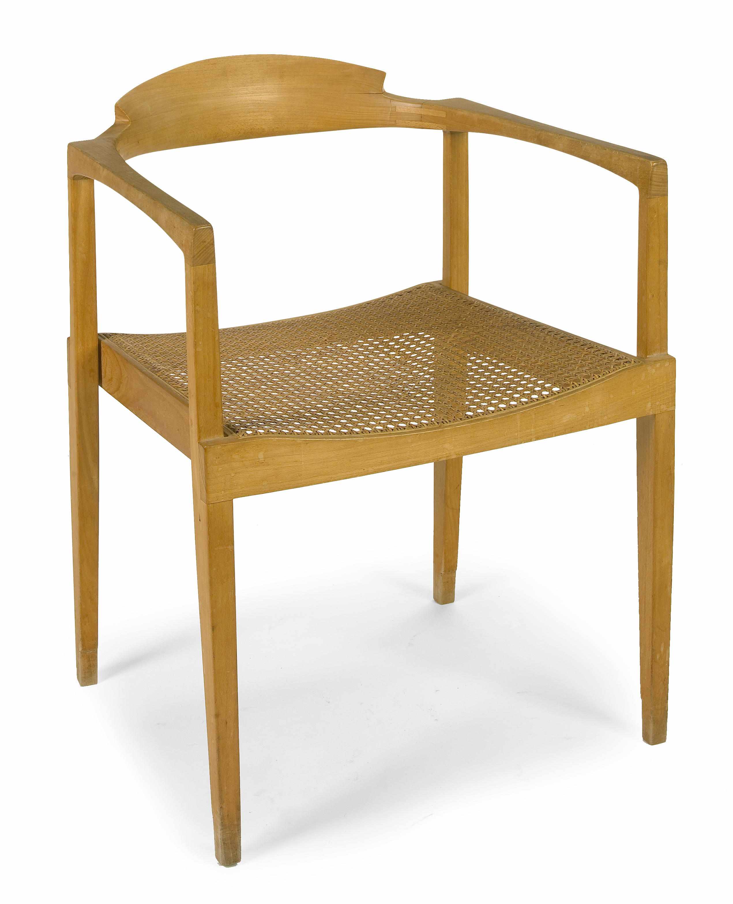 Appraisal: A Paul Tuttle carved and caned blond wood chair circa