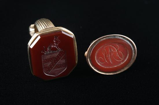 Appraisal: TWO VICTORIAN EDWARDIAN INTAGLIO-CUT CARNELIAN FOB SEALS One oval with