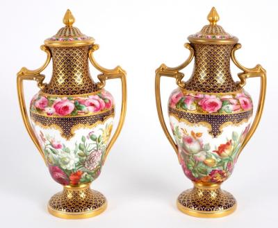 Appraisal: A pair of Copeland two-handled vases and covers painted luxuriant