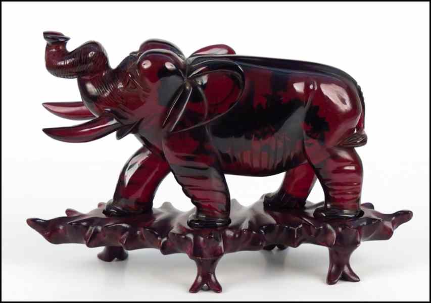 Appraisal: CHERRY AMBER ELEPHANT Provenance The Collection of G Jules Marder