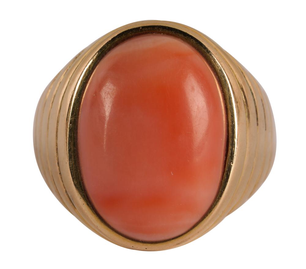 Appraisal: KARAT YELLOW GOLD CORAL RINGcentering one oval cabochon cut coral