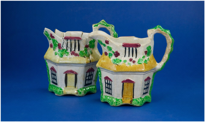 Appraisal: Staffordshire Jugs Modelled As Cottages With Floral Borders A F