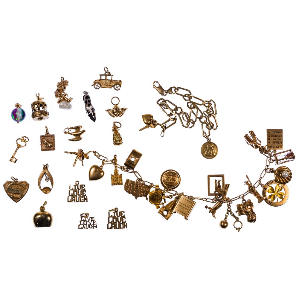 Appraisal: K GOLD CHARM BRACELET AND CHARM ASSORTMENT items including a