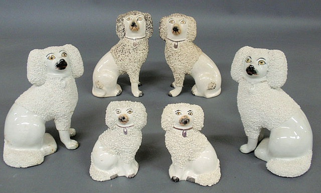 Appraisal: Three pairs of Staffordshire poodles th c largest h