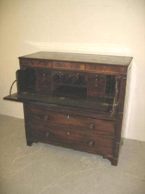 Appraisal: A MAHOGANY SECRETAIRE CHEST the moulded edged top over string