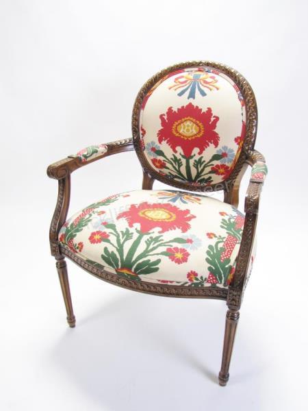 Appraisal: A French period style decorator arm chair with floral upholstery