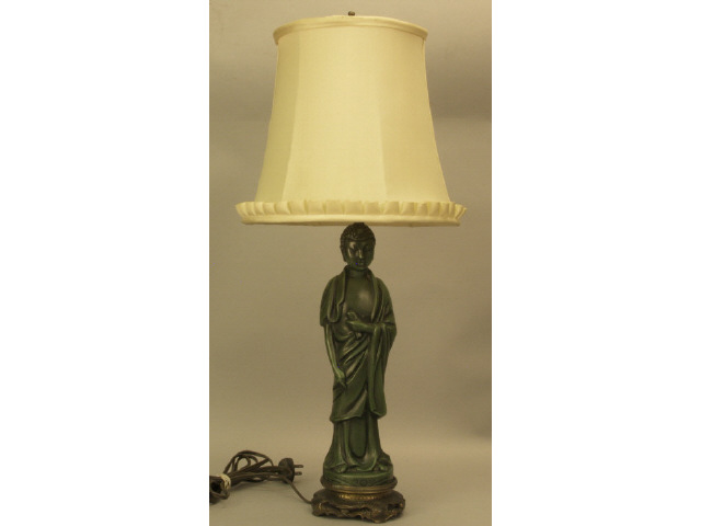 Appraisal: Oriental metal and brass figural lamp with ruffle cloth shade