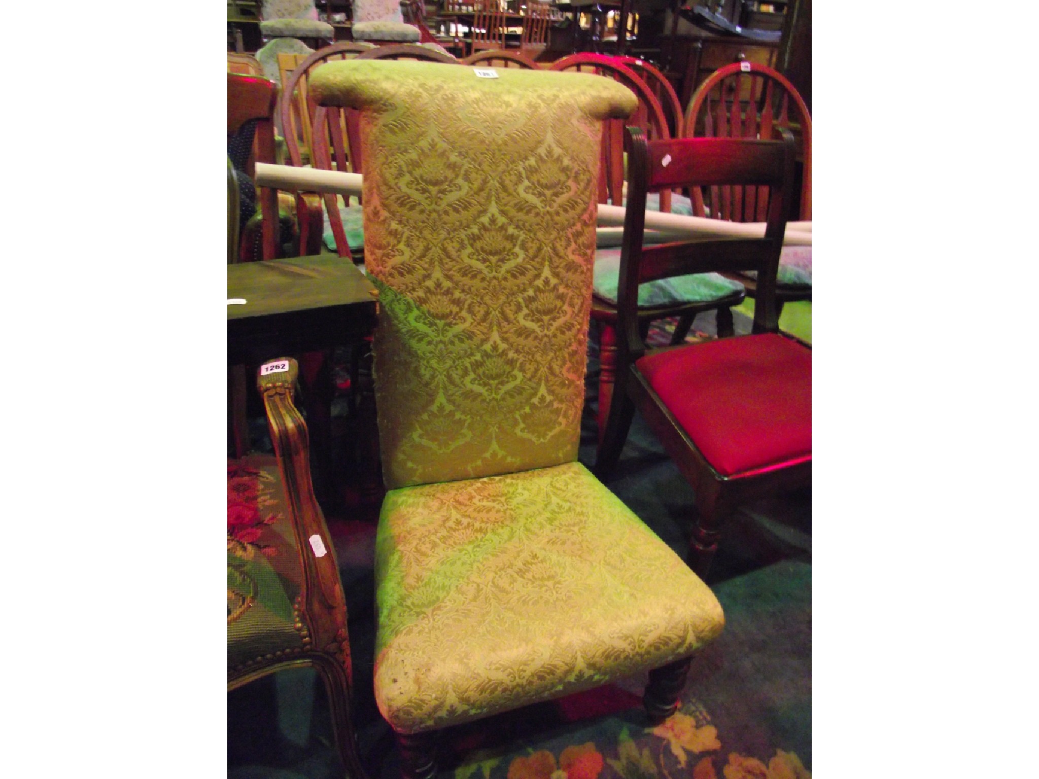 Appraisal: A Victorian prieu dieu with floral patterned upholstered seat and