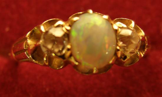 Appraisal: Opal and diamond three stone ring set with a centre