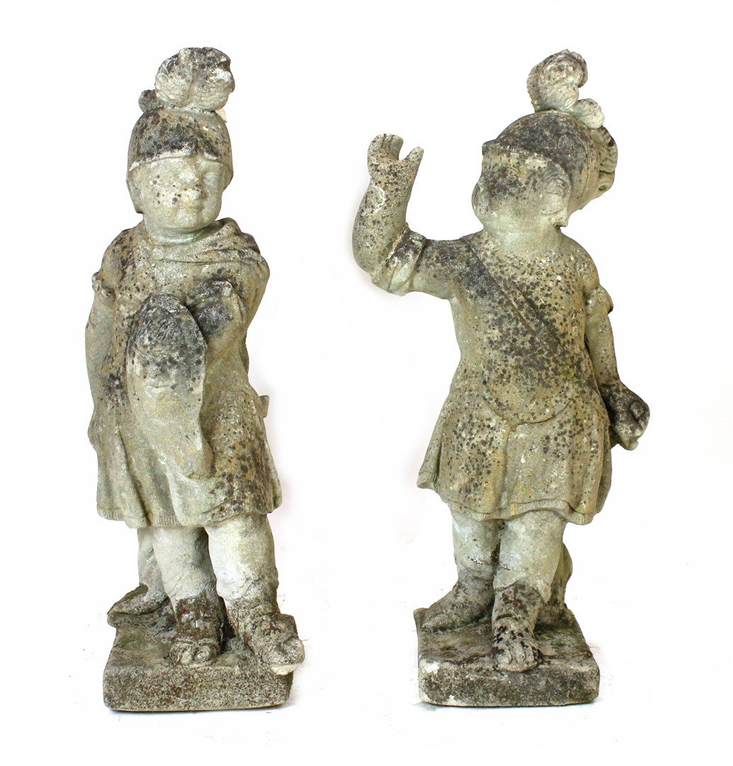 Appraisal: A pair of reconstituted stone figures of children in Romanesque