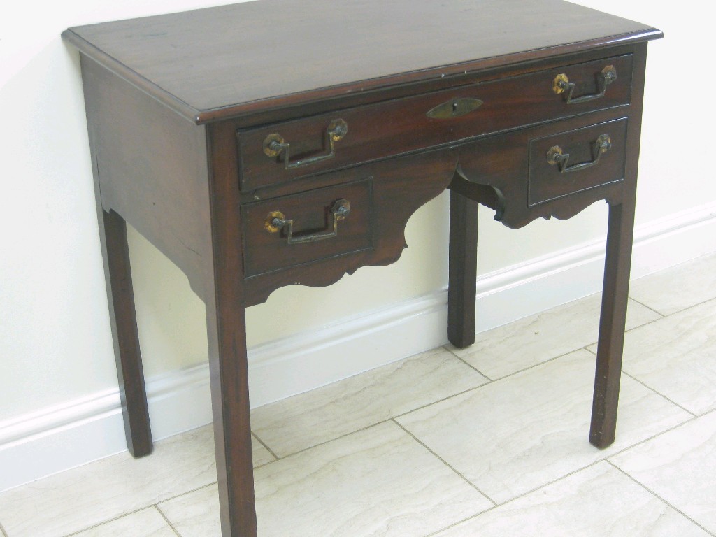 Appraisal: A George III mahogany Lowboy with one long and two