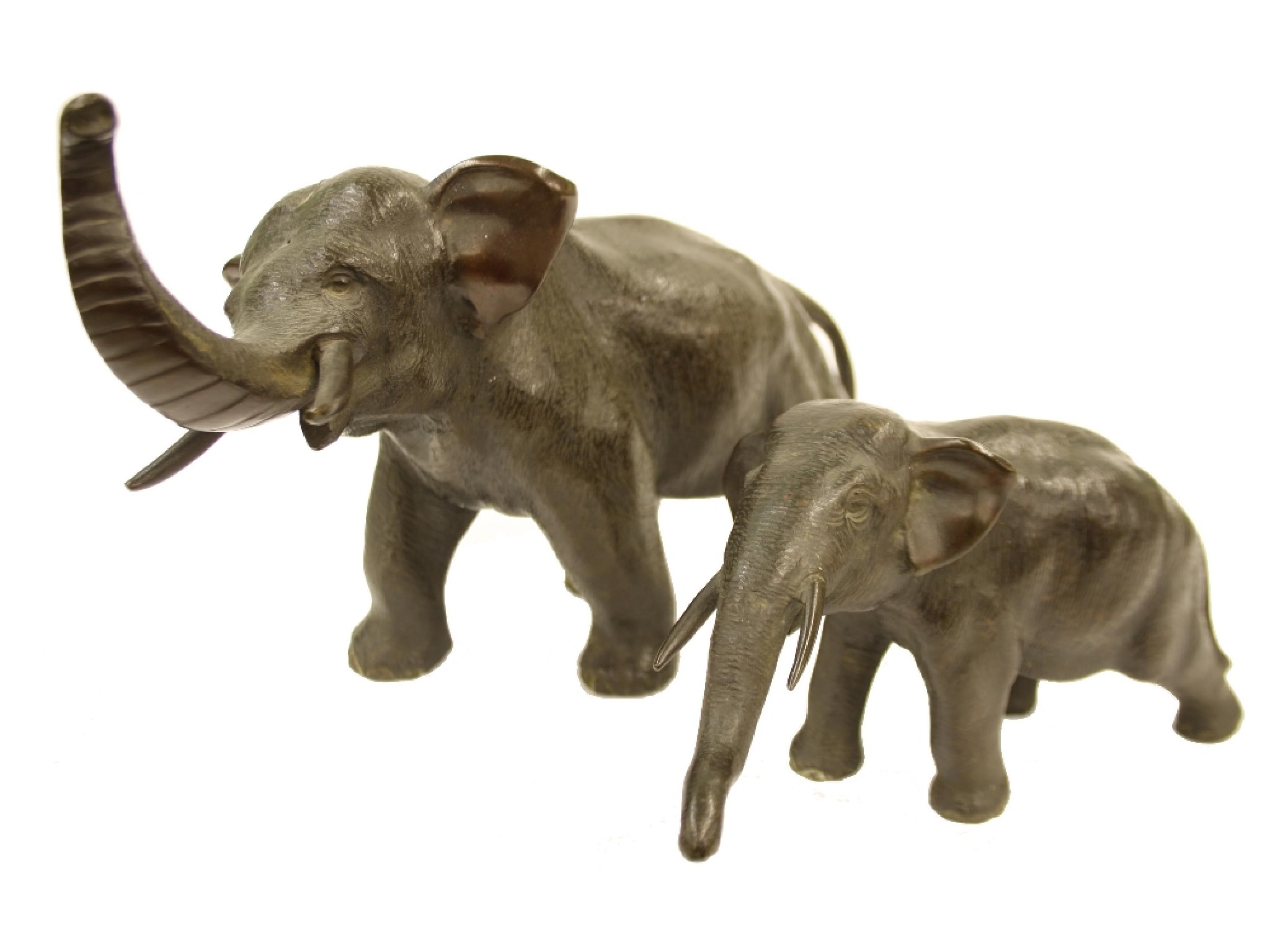 Appraisal: Two similar bronzed elephant figures the largest high x long