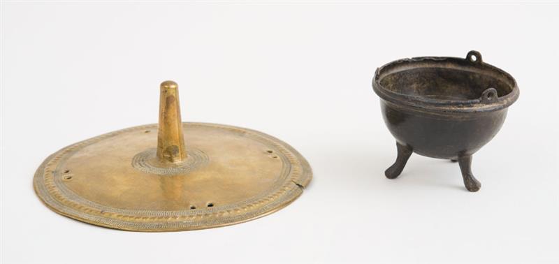 Appraisal: ANCIENT BRONZE BOWL ON TRIPOD FEET Together with a brass