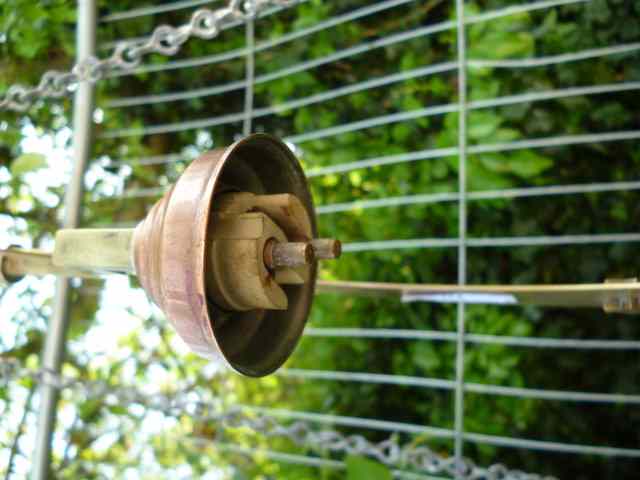 Appraisal: A BRASS AND COPPER CRESCENT MOON HANGING CEILING LIGHT high